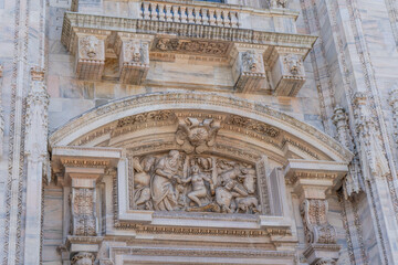 Duomo di Milano square in Milan city. Gothic Italian architecture. Italy. Sculptures and statues...