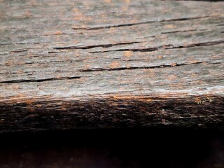 Obraz premium Old weathered brown wooden wall with rough texture and natural wood grain pattern