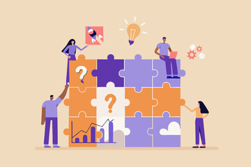 Teamwork and problem solving with a jigsaw puzzle and business elements