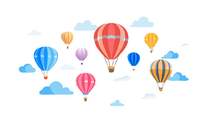 Colorful hot air balloons float serenely through a sky filled with fluffy white and blue clouds