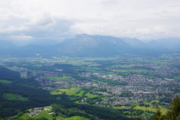 Fototapeta premium The panorama of Salzburg and the Untersberg mountain ridge from Gaisberg mountain, Austria