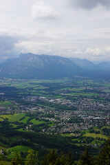 Fototapeta premium The panorama of Salzburg and the Untersberg mountain ridge from Gaisberg mountain, Austria