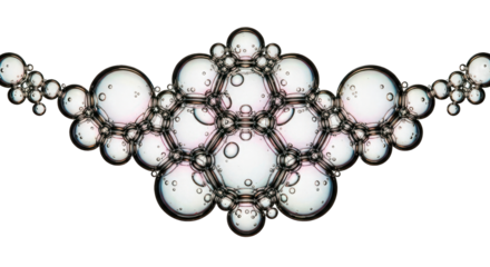 Cluster of iridescent bubbles forming hexagonal patterns, isolated on black background