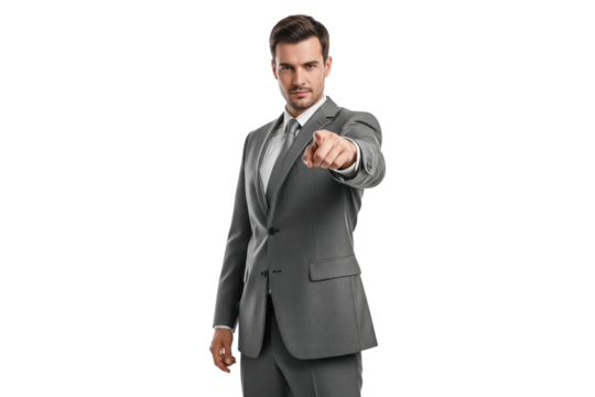 Confident businessman in grey suit pointing forward