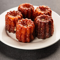 Canneles sweet dessert french cuisine sweets fresh delicious gourmet food background on the table...