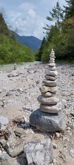 Zen balance with stones by the stream