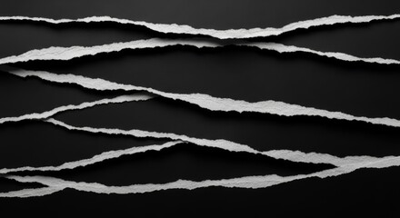 ripped pieces of black paper making a vibrant background texture