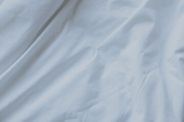 Abstract white fabric background. Elegant and soft material with wavy folds and a smooth texture. Copy space