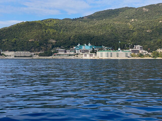 View of Saint Panteleimon Monastery on Mount Athos, Greece, from the Aegean Sea, surrounded by...