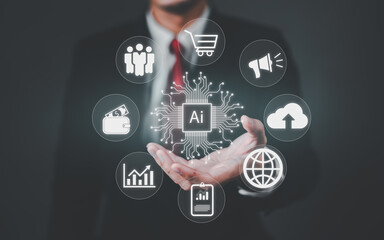 Businessman hand holding AI chip surrounded by business application icons including shopping cart, analytics, marketing, finance and cloud computing. Digital transformation and automation concept.