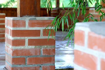 Charming brick pillars set in lush, tranquil greenery