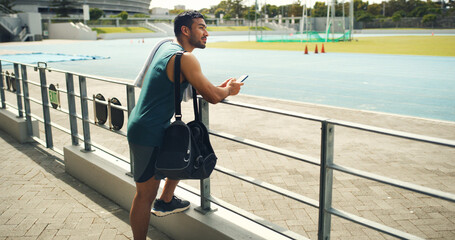 Thinking, athlete and man with smartphone, field and sportswear for fitness, calm and workout...
