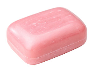 A soft pink bar of soap evokes gentle cleansing promising a spa like serenity isolated on dark