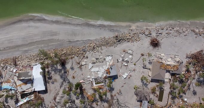 Destroyed houses on ocean shore after hurricane Milton landfall. Natural disaster consequences on Manasota Key, Florida. Storm surge severe damage.