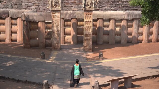Woman tourist visit to the Sanchi Stupa, UNESCO World Heritage Site, Madhya Pradesh, India.