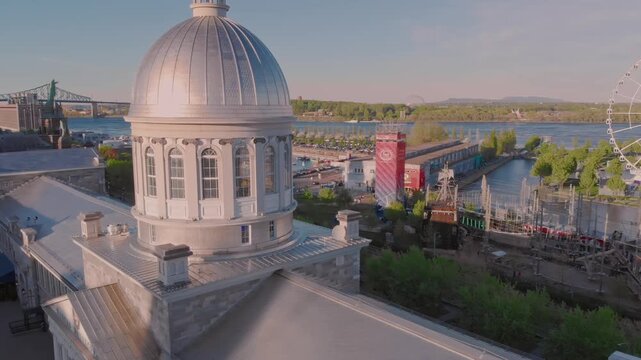 Aerial view of the Bonsecours Market dome in Old Montreal, Quebec, Canada. The photo showcases the historic architecture and waterfront location.