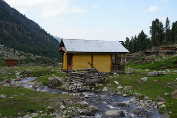 wooden cottage in mountains