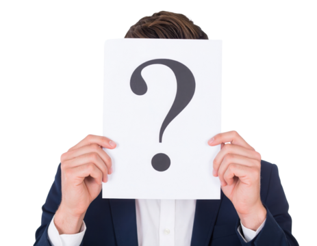 A person holds a sheet of paper displaying a large question mark, obscuring their face.