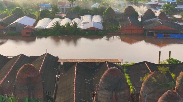 Aerial view of Mang Thit brick kiln in Vinh Long. Burnt clay bricks used in traditional construction of Vietnamese, Mekong Delta, Vinh Long province, Vietnam