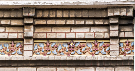 Details of the ceramic decoration on the facade of an old seaside villa in the town of...