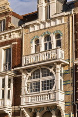Fototapeta premium ornate historic townhouses with distinct architectural styles. The scene captures the charm of coastal architecture in Dunkirk, France