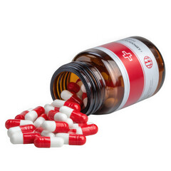 Red and white capsules spilling from a brown glass medicine bottle