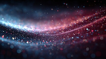 Abstract digital artwork of swirling, glowing particles.  A mix of vibrant blue, pink, and red glittery particles create a wave-like effect against a dark background.  The particles are in motion