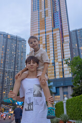 Fototapeta premium Family with children, boys, visiting Ho Chi Minh city, Saigon, fot a holiday, enjoying asian culture