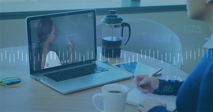 Taking notes woman wearing sweater at home desk, with laptop, pen and notebook, copy space