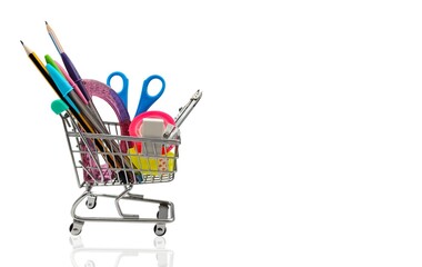 Photo of a shopping cart filled with variety of school supplies, isolated on white background,...