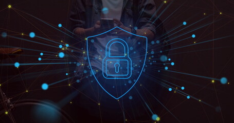 Man holding smartphone behind network overlay in room, padlock shield glowing and handlebar visible