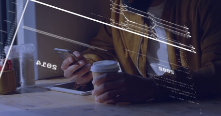 Man's hands holding smartphone and coffee cup, tapping tablet at cafe table with digital overlays