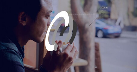 Holding mug and sipping coffee, Asian man gazing through cafe window, digital overlay, copy space