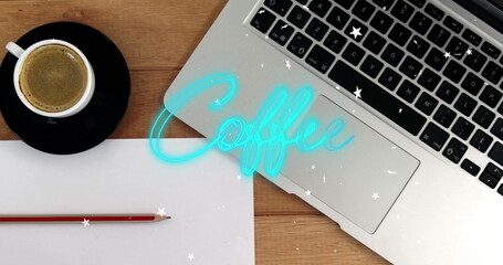 Displaying laptop showing glowing blue text at home office, with coffee cup, pencil on white paper