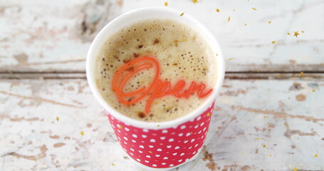 Red polka dot cup sitting in rustic cafe, with frothy coffee, gold confetti, neon Open overlay