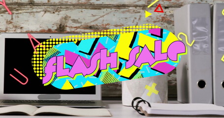 Displaying FLASH SALE graphic overlay over wooden desk area, featuring laptop and notebook