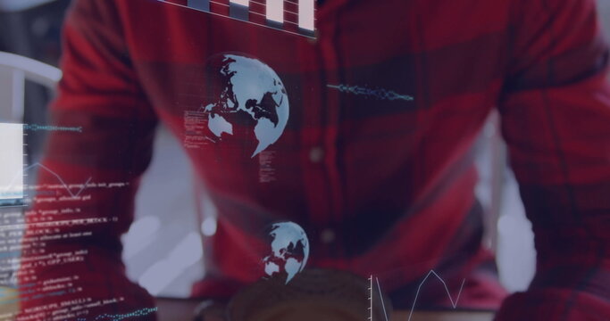 Programmer in red plaid shirt analyzing holographic overlays in office, with laptop and coffee mug - Powered by Adobe