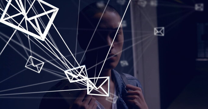 Standing man wearing denim jacket holding backpack in dark corridor, with floating envelope icons