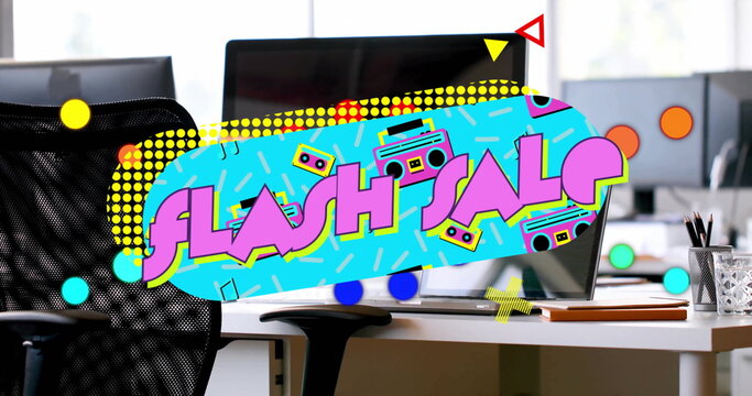 Displaying vibrant flash sale graphic in open-plan office, with computer monitors and chair