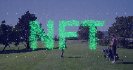 Swinging mid adult male golfer hitting golf ball on sunlit fairway, golf bag, club NFT letters