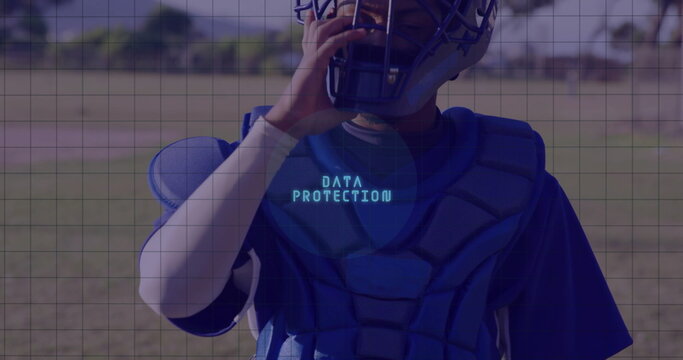 Male athlete in catcher's helmet adjusting mask on baseball field, with DATA PROTECTION chest guard - Powered by Adobe