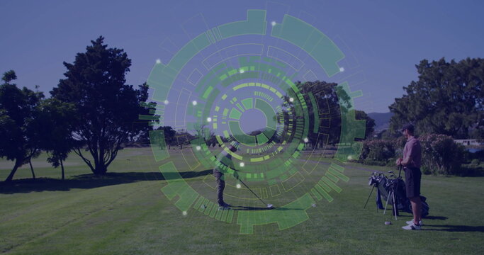 Swinging golfer hitting golf ball on tee box, friend standing next to golf bag, translucent overlay