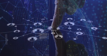 Touching male finger selecting central node on holographic network interface, with hexagonal grid
