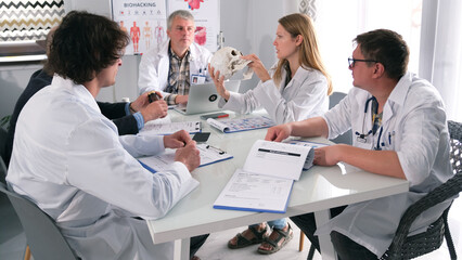 A group of scientists is discussing an amazing find from ancient times. Researchers conduct data...
