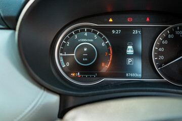 dashboard of car shows the fuel gauge at 7.5 liters