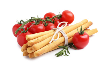 Delicious grissini sticks with fresh tomatoes and rosemary isolated on white