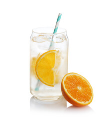 Sparkling water with orange slices in glass and fresh fruit isolated on white