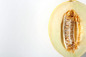 Half of ripe melon on white background, top view. Space for text