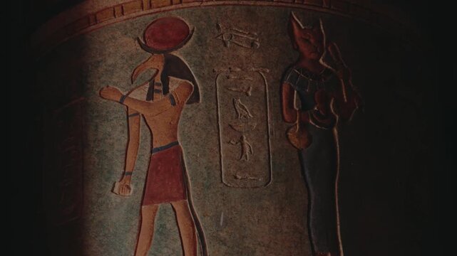 Ancient Egyptian Gods Thoth and Bastet depicted on a painted clay pot. Intricate details and vibrant colors bring history to life. Explore the rich culture and mythology of the Pharaohs.