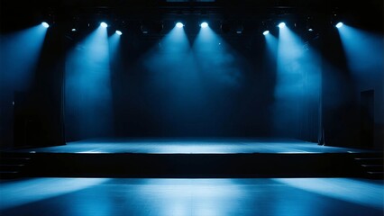A stage illuminated by blue spotlights with an empty performance area, suitable for various events and performances.